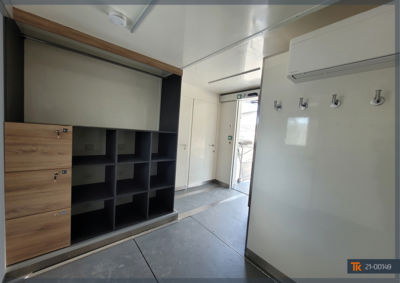 Large locker room with custom-made furniture for the drivers' and officials' equipment